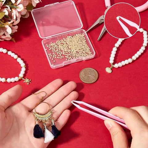 24K Gold Plated Chip Solder 2x2mm with jewelry tools, pearl bracelets, and pink tweezers on red background