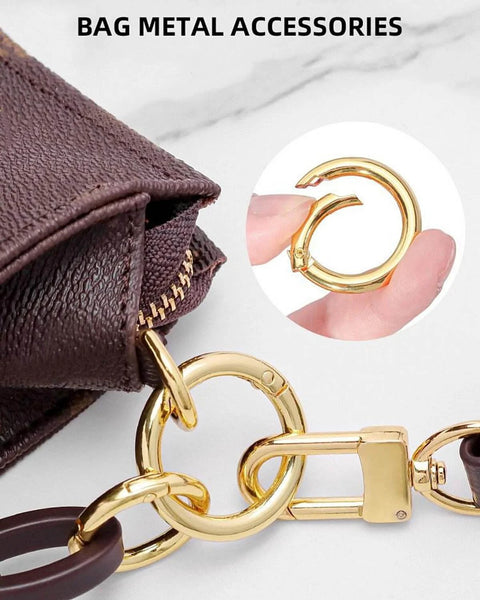50 Pack 1 Inch Metal Spring O Rings Set With Round Carabiner Clips Snap Hooks For Keychains Purses Shoulder Bags And DIY Crafts In Gold Finish connected to a brown bag.