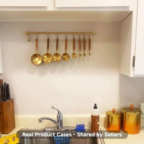 Kitchen Hanging Racks 304 Stainless Steel 20 Inch Rail Utensil Storage Hanger with golden finish and measuring spoons above sink