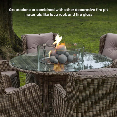 12 Pack Gray Ceramic Balls, Mixed 4 Sizes Fireplace Balls on glass-top table with fire pit, outdoor setup
