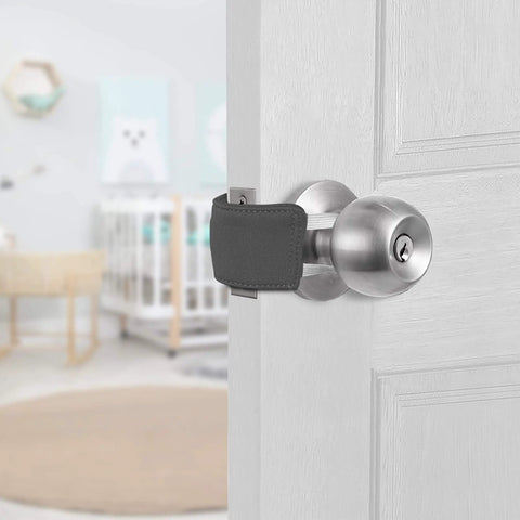 2 Pack Silent Door Latch Covers For Quiet Close Doors installed on interior door, gray neoprene reducing noise in nursery.