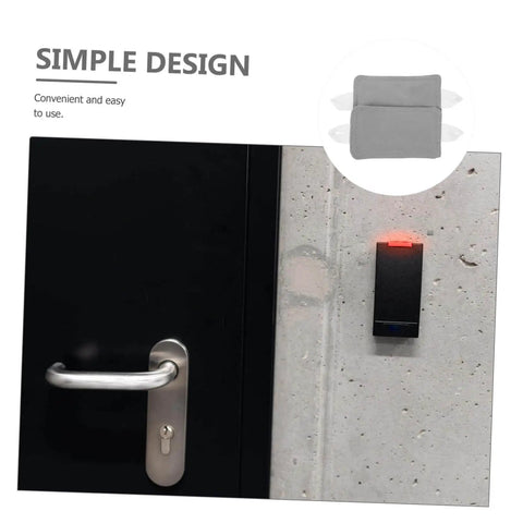 Two door silencers with elastic bands reduce noise and protect doors in nurseries, bedrooms, offices, and libraries; no drilling required, simply suspend on the door knob for damage-free, quiet environments. Shown are installed grey silencers on a door handle.