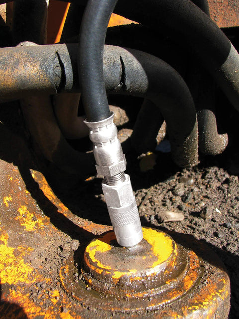 Grease Joint Rejuvenator Master Kit with 5-inch flex hose in use, unclogs and replenishes bearings on heavy equipment