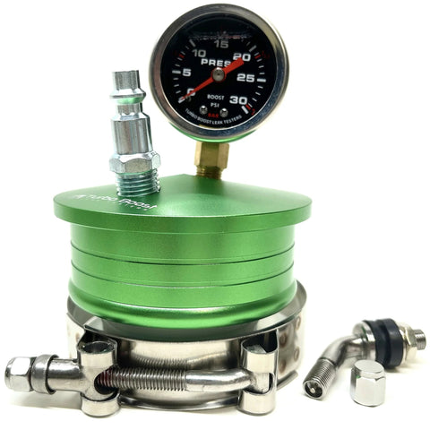 Medium aluminum boost leak tester with green anodized base, pressure gauge, and metal fittings.