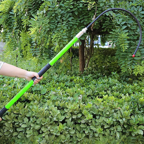Person holding Insulated High Voltage Rescue Hook With Non Conductive Handle 2m Hot Stick Rescue Tool For Electric Shock Emergencies Heavy Duty U Shaped Hook In Green Ideal For Power Stations Factories Auto Repair And Field Work outdoors.