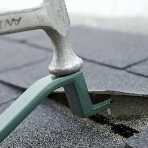 Roof Snake RS501 Shingle Pry Bar for nail removal and damaged shingle replacement shown during use on roof with hammer.