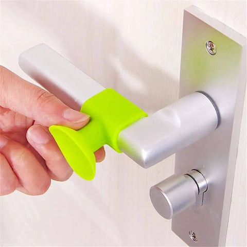 Close-up of a soft silicone anti-collision door protection pad with a suction cup on a metal door handle