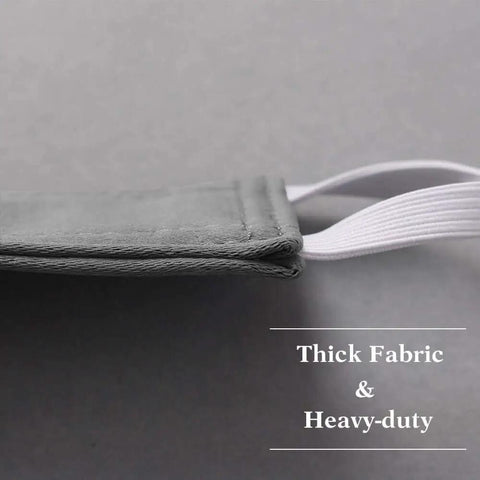 Side view of grey Baby Door Latch Cover Silencer for Nurseries, thick cushion and soft three-layer fabric with elastic straps.