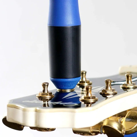 All-In-One Guitar String Changing Kit With Winder, Cutter, Puller And 10mm Wrench tool in use on guitar headstock