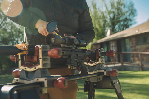Person using Pro Grade Reticle Leveling System With Heavy Duty Aluminum Construction For Gunsmithing And Maintenance on rifle outdoors
