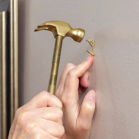 Person using the 5 In 1 Hammer With Built In Screwdrivers Chrome Plated To Resist Rust Lightweight Compact Multitool Hammer