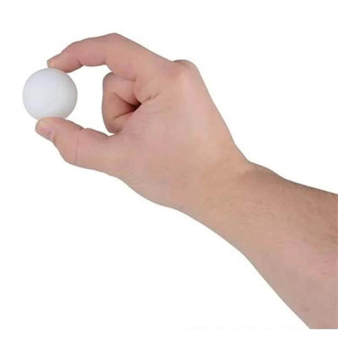 Hand holding a Rhode Island Novelty 1.5 Inch Plastic Ping Pong Ball, Pack of 12, showing size and material.