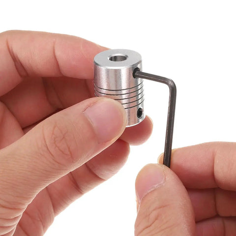 Close-up of Five Pack Aluminum Shaft Coupling Set 8mm To 8mm For CNC Machines And 3D Printers Flexible Motor Couplers with key wrench