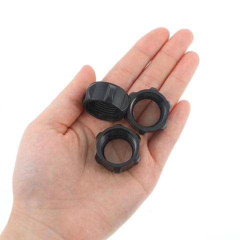 Hand holding six pack replacement tightening nuts for 17mm ball head car mounts screw on adapters M17 by one point five thread