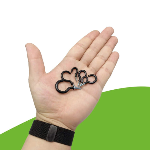 Person holding black vinyl coated cup hooks from the Vinyl Coated Cup Hook Kit With Screws And Plugs, 46 Pcs, Six Sizes.