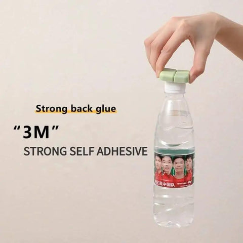Hand holding a water bottle with a green cap and text '3M Strong Self Adhesive' displayed beside.