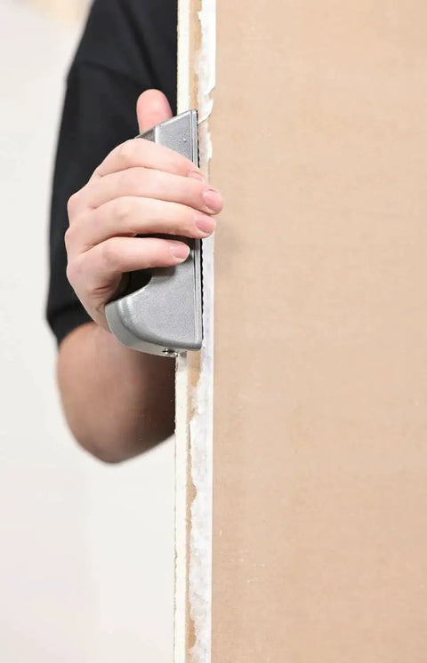 Person using Pocket Drywall And Ceiling Tile Rasp With Replaceable Blade Designed For Fine Edge Trimming Of Drywall And Tiles Compact Tool