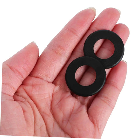 Hand holding black Foosball Table Rod Washers Replacement Set Smooth Easy Install for Standard Foosball Machines Durable Plastic Washers