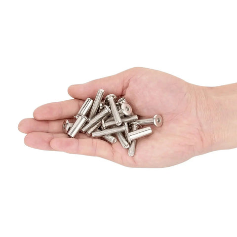 Hand holding various metal pieces from 100 Piece M6x30mm Hexagon Nuts And Bolts Assortment Kit With Cap Nuts And Socket Covers For Machine Screws.