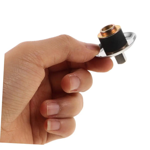 Hand holding stainless steel juicer drive coupling replacement part easy install durable juicer coupler for most juicers keeps performance strong and efficiency high kitchen grade replacement accessory.