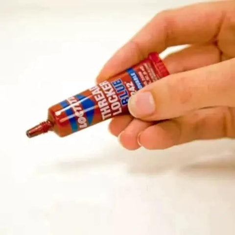Hand holding Removable Thread Locker Blue 242 for Nuts Bolts and Fasteners Medium Strength Prevents Loosening and Corrosion 6 ml 1 Pack