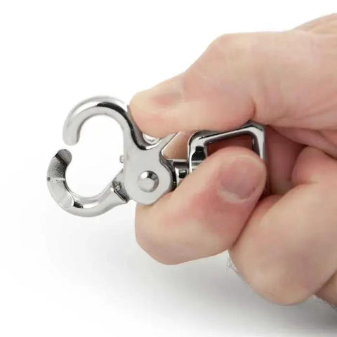 Person holding Heavy Duty Trigger Snap Clip With Swivel Square Eye Two And A Half Inch Nickel Plated Die Cast for rope and utility use