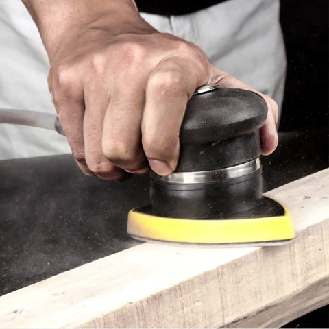 Person using 120 Grit Mouse Detail Sander Sandpaper 50 Pcs 5 Hole Hook And Loop 140mm Sheets on wood surface.