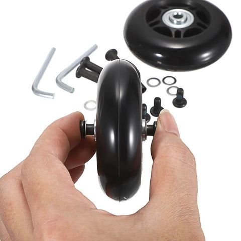 Hand holding 75mm x 23mm Luggage Wheels Replacements Set of 2 Mute Suitcase Replacement Wheels with Black Screws Axles Bearings in the background