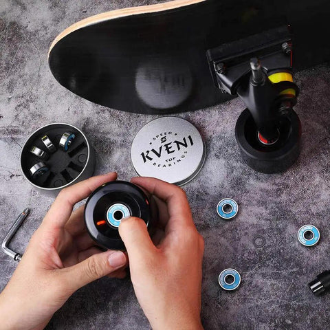 Person installing Ceramic 608RS Skateboard Bearings With Chrome Steel Balls ABEC Precision on a skateboard, shown in blue, 8-pack