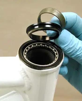 Installing premium headset bearings set of two for one and one eighth inch headsets, 5/32 inch 20-ball, on bike.