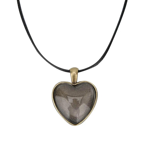 Heart-shaped pendant on black cord, part of Necklace Base Tray Pendant Mold Kit For DIY Jewelry Making With 60 Pieces Of Metal And Plastic Shapes Durable Construction For Long Lasting Use Perfect Starter Set For Beading Crafting And Pendant Projects For Crafters And Hobbyists.