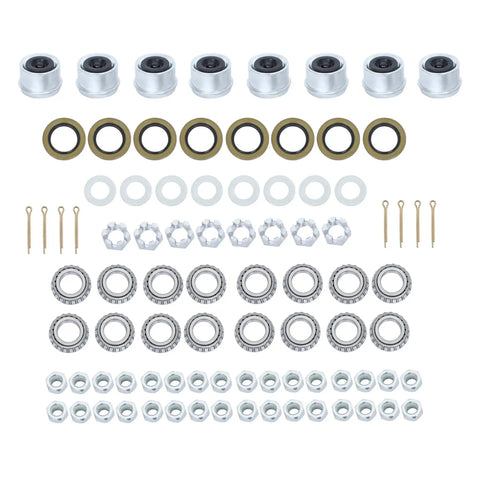 Heavy Duty Eight Set Four On Four Trailer Hub Kit With BT8 Spindle And Seven Piece Bearing Kit For 2000 Pound Axles laid out on display