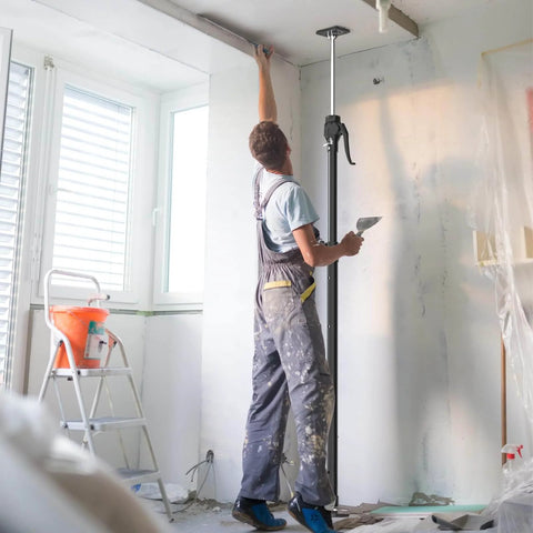 Worker using ✝️ Third Hand Support Pole Heavy Duty, Cabinet Jacks for Installing Cabinets with 154 LBS Capacity in room
