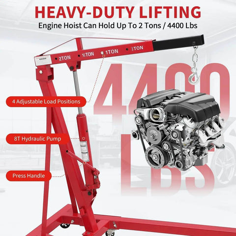 Heavy Duty 2 Ton Folding Hydraulic Engine Hoist With Load Leveler And Adjustable Boom From 0.5 To 2 Tons, 6 Swivel Wheels, 4400 Lbs Capacity hoisting an engine