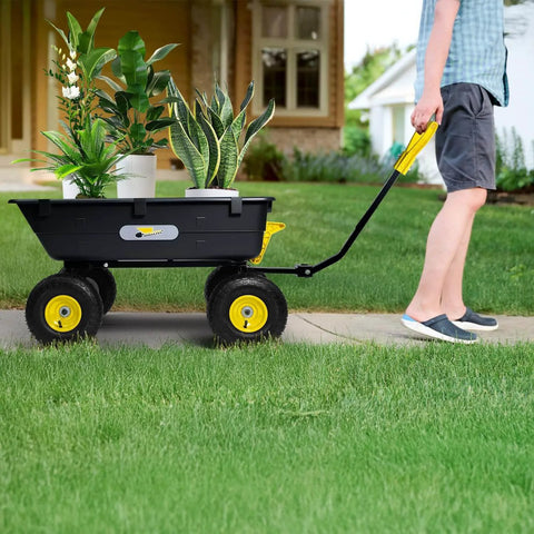 Person pulling Heavy Duty Garden Dump Cart Utility Wagon with 900 LB Capacity, 10 Inch Pneumatic Tires, 180 Degree Pivot Steering