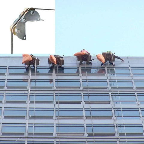 Pulley Hoist system used for lifting on a skyscraper facade with workers, featuring pulleys and rope for Material Handling and Moving Lifting.