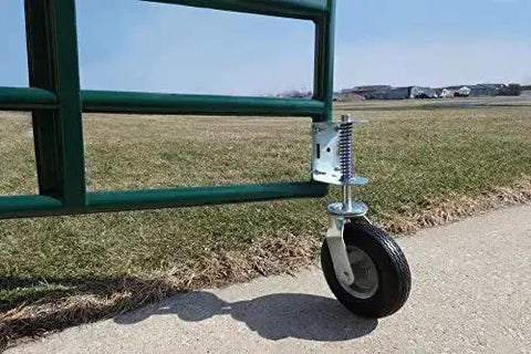 Heavy Duty Flat Free Spring Gate Caster with Universal Mount Eight Inch Wheel on green metal gate on concrete and grass surface