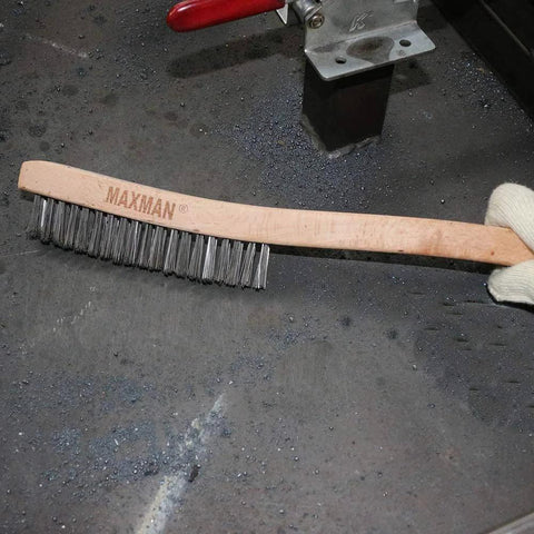 Wire Brush, Heavy Duty Stainless Steel Wire Brushes for Cleaning Rust, 14" Long Beech Handle shown on industrial surface