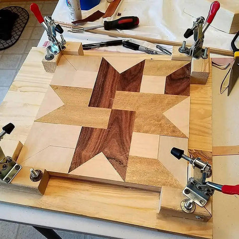 Heavy Duty 5 Pack Hold Down Toggle Clamps With Quick Release, 200 Lb Holding Capacity, securing wooden panel with star pattern.