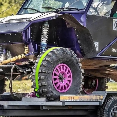 Heavy Duty Wheel Chock Tie Down Straps Set Two Pack With 4,400 Lb Max Break Strength securing an ATV on a trailer