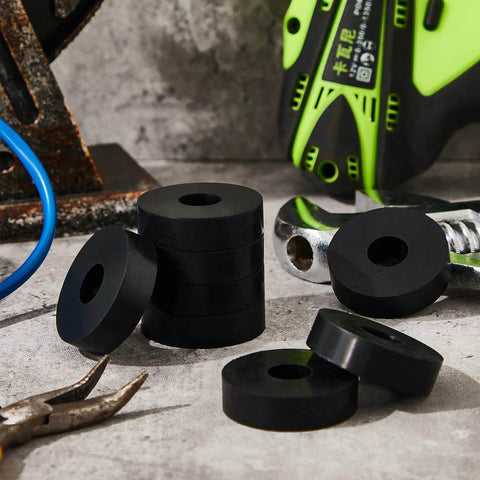 Black rubber washers displayed on a workbench with scattered tools, highlighting utility components of ✝️ 8-Pack Utility Cart Built for Moving Boxes, Appliances, and Heavy Cargo at Home, Warehouse, and Delivery Jobs with Stable Rolling, Easy Steering, and Compact Storage Design for Daily Transport Tasks.