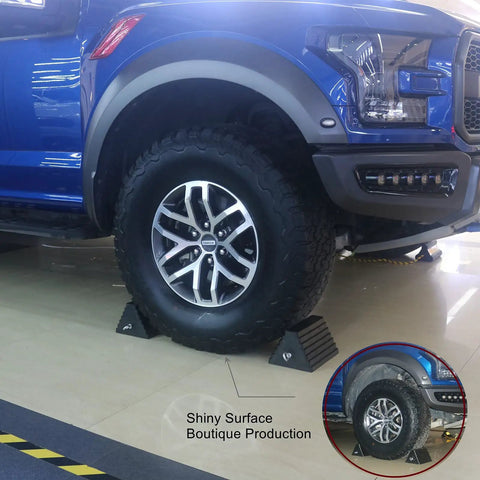 Heavy Duty Wheel Chocks 2 Pack For Travel Trailers With Eyebolt under a blue truck, Brazilian Natural Rubber