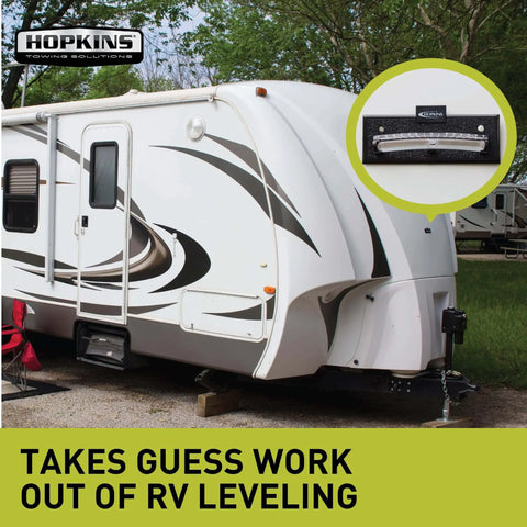 RV parked with Never Fade Two Way Graduated Level For Trailers And Vehicles Hopkins Towing Solutions Black UV Resistant Markings Show Exact Inch Adjustments installed on the side.
