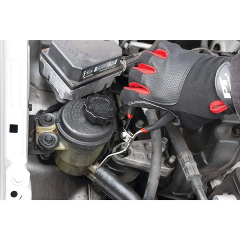 Using hose removal pliers for fuel, vacuum, and heater hoses, 5/32 to 1/2 inch capacity, heavy duty steel, in tight engine bay