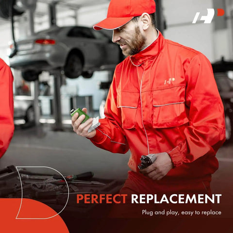 Mechanic in red uniform holding HVAC Blower Motor Resistor Kit With Harness Replacement For Chevy in an auto shop.