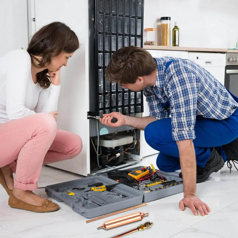 Technician using Refrigerator Filter Dryer With Access And Service Valve And Three In One HVAC Tool Kit for refrigerator repair