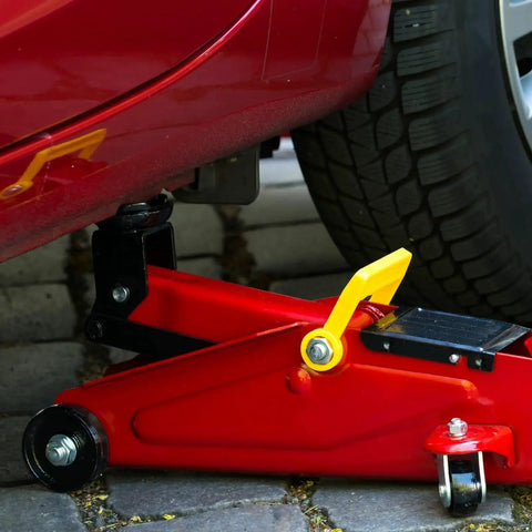Universal Steel Front Wheel Replacement For Hydraulic Floor Jacks 2.5 Ton To 3.5 Ton installed on a red hydraulic jack