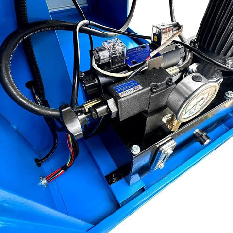 Close-up of hydraulic system components on 7HP Programmable Electric Hydraulic Tube And Pipe Bender with dies shown, PLC control visible