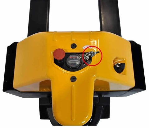 Ignition Key For Big Joe Electric Pallet Jacks Replacement 1115-500016-00 inserted in yellow control panel