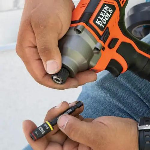 Person using a Three In One Flip Socket For Impact Drivers With One Quarter Inch Quick Connect And Five Sixteenth Inch Hex Drivers.